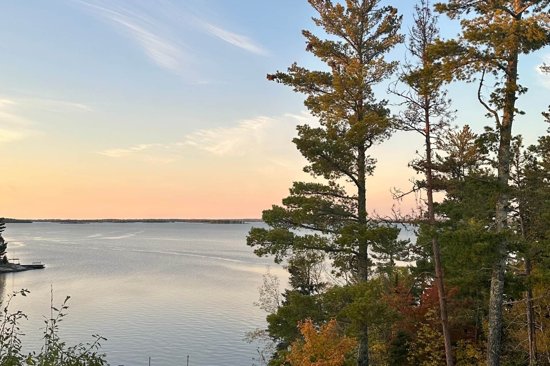 Sunset view over Lake Kabetogama with dock and boat